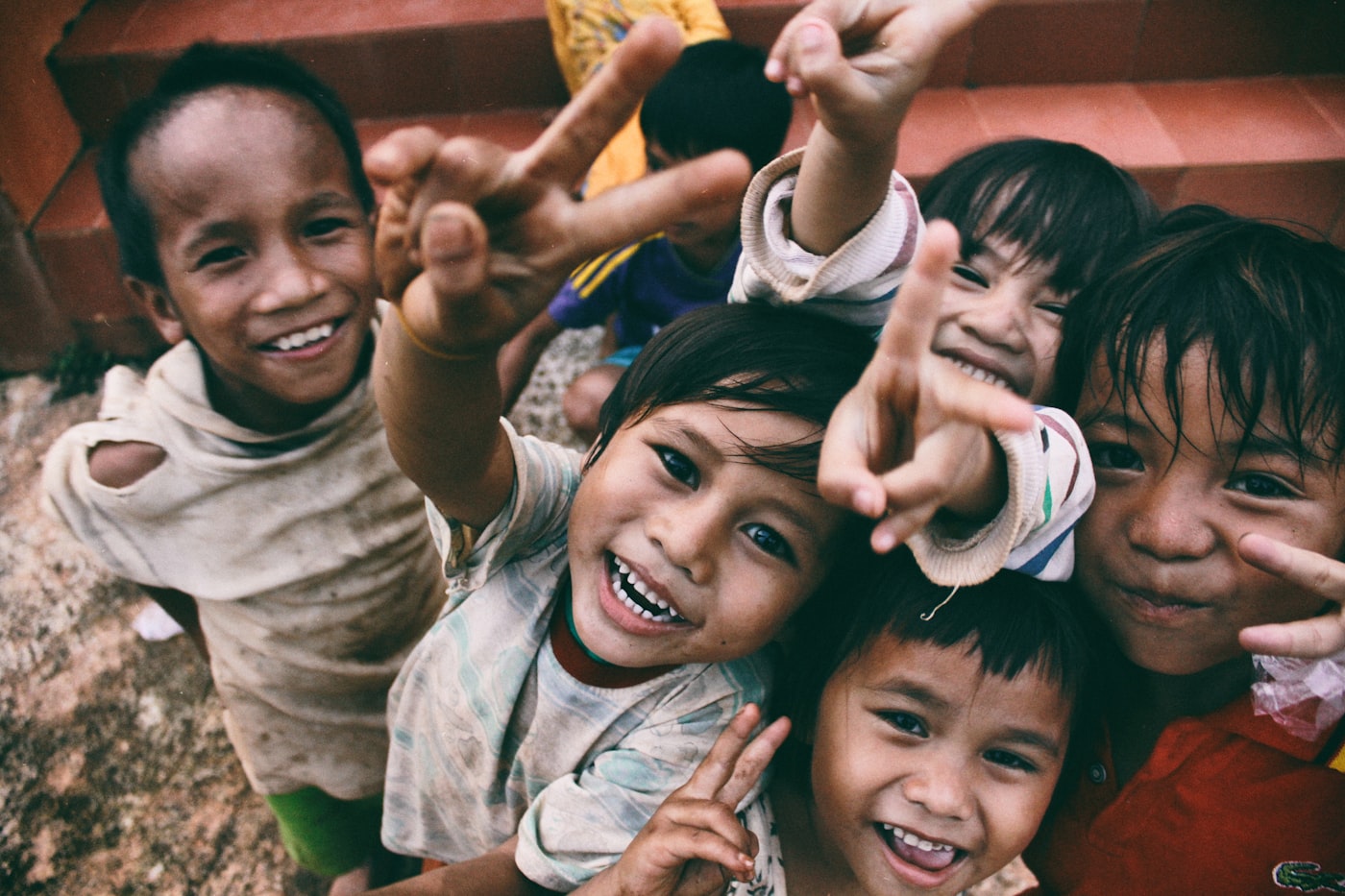 African children smiling together in a community setting